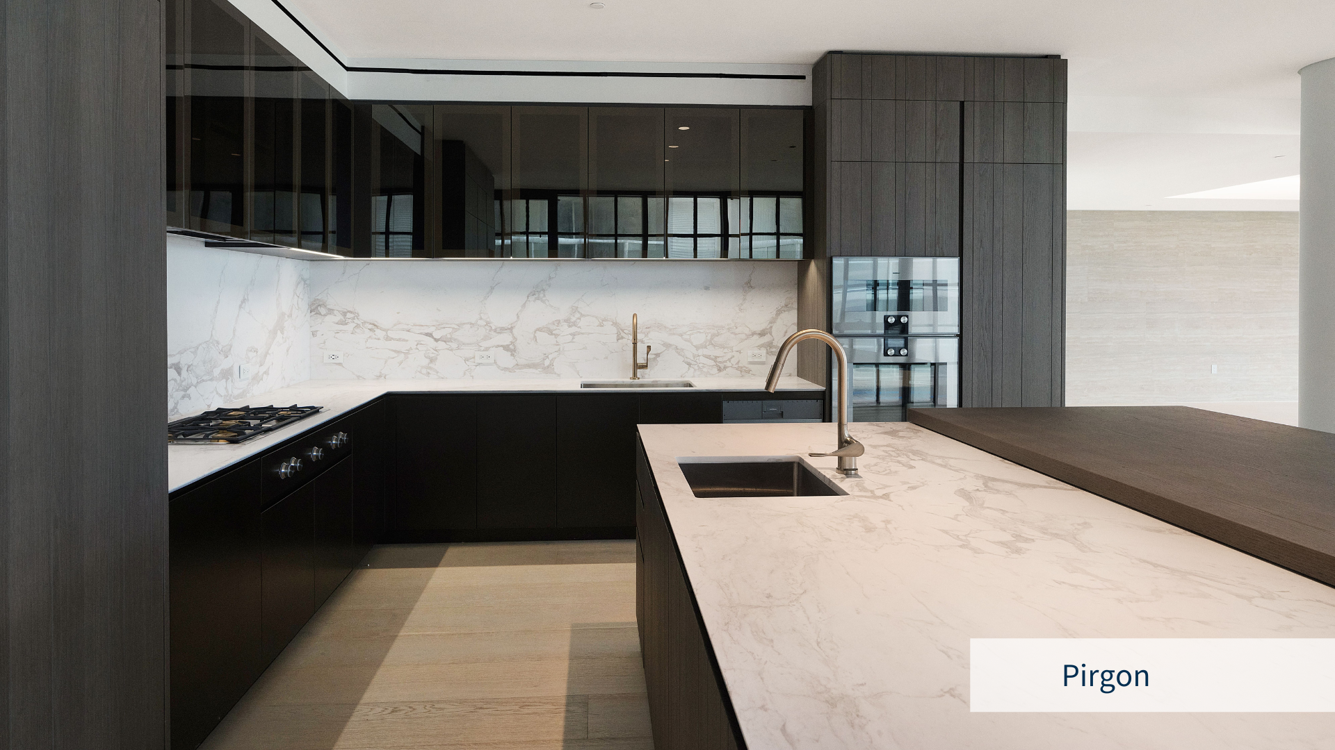 Image of a minimal kitchen with dark brown wenge furniture and Pirgon white Greek marble installed in the kitchen counter and wall cladding backsplash