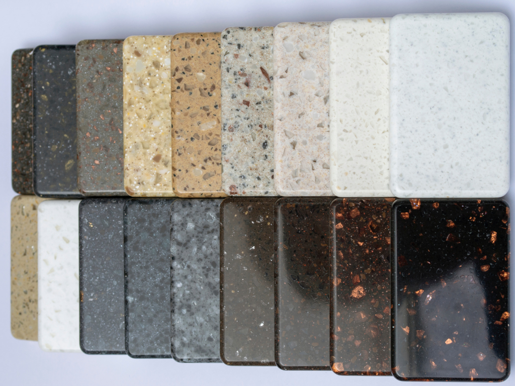 Rows of samples of granite small pieces in different colours and patterns