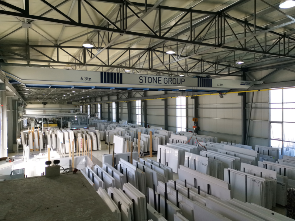 Slabs of marble organized in indoor warehouse in Greece. Types & Dimensions Of Thassos White Marble Tiles.