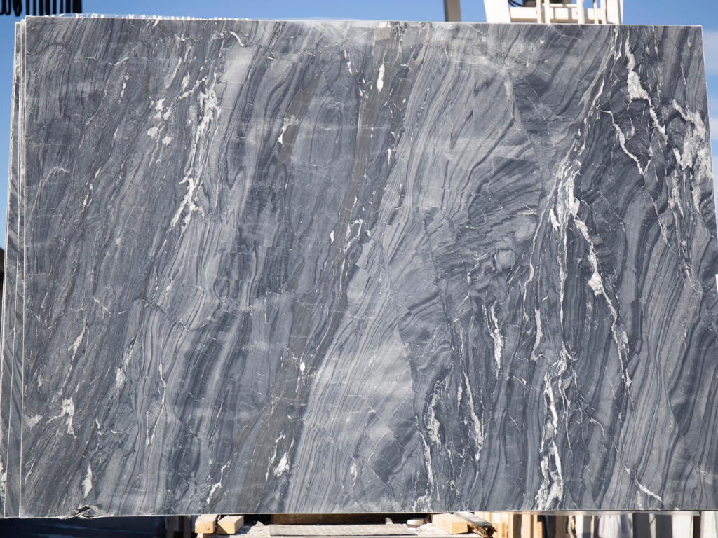 Slab of glory marble a dark gray background and striking white veins. Some Of The Best-colored Marbles That You Need To Know