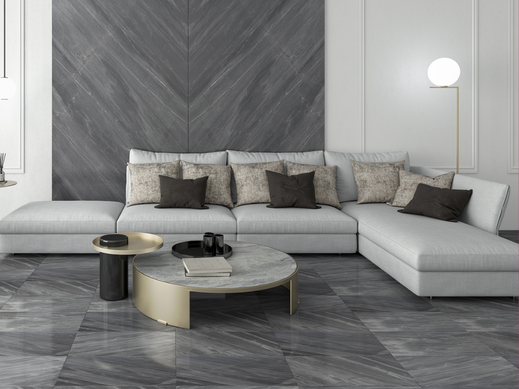 Living room rendering with grey hues and bookmatched stone slabs in the wall, white couch, modern interior design