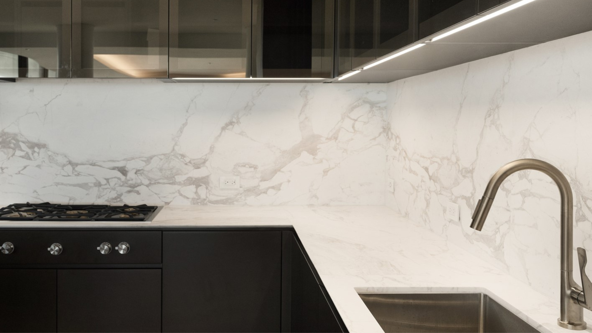 Minimal rendering by Stone Group International kitchen backsplash with white vein matched marble, with light veins